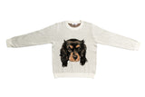 A light heather gray crewneck sweatshirt featuring a detailed graphic print of a black and tan Cavalier King Charles Spaniel dog face on the front, displayed flat against a white background.