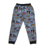 Superman-themed pajama pants with logos and characters on a blue background