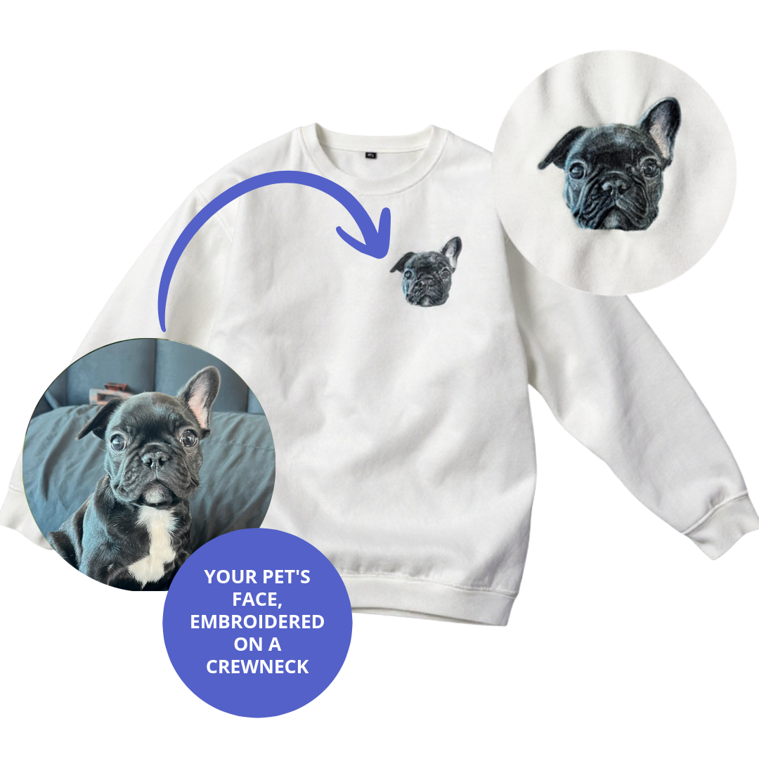 White sweatshirt with embroidered pet face design on a white background.