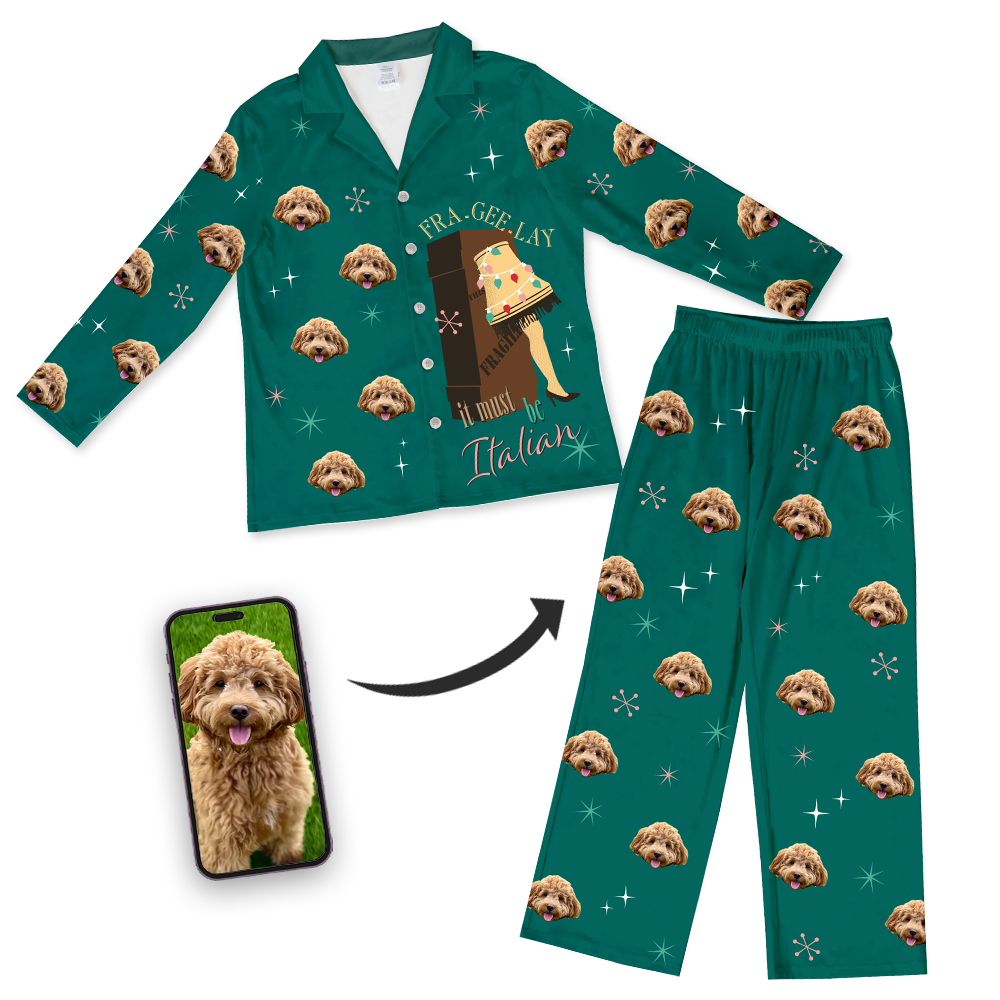 Green button-down pajama set featuring a repeating dog's face pattern with snowflakes and the iconic leg lamp from 'A Christmas Story' with the phrase 'Fra-gee-lay it must be Italian', shown next to a smartphone displaying the dog's photo with an arrow illustrating how the pet's photo is placed on pajamas.