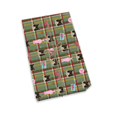 A wrapped gift box on a plain white background, wrapped in green plaid wrapping paper with a repeating pattern of black-and-white cats, pink bows, and small blue gift tags tied with a twine string [RalphiesBunnySuit]