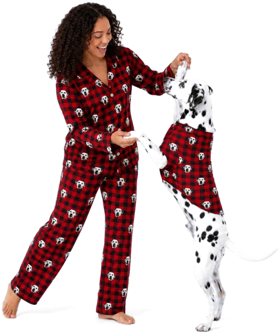 Woman and her Dalmatian in matching red buffalo-plaid pajamas printed with the dog's face