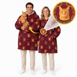 A man and a woman modeling matching burgundy hooded robes with an orange and gold cat-themed print, shown on a white studio background. One model holds an orange cat, and circular inset graphics highlight the robe print and a transparent neck collar accessory.