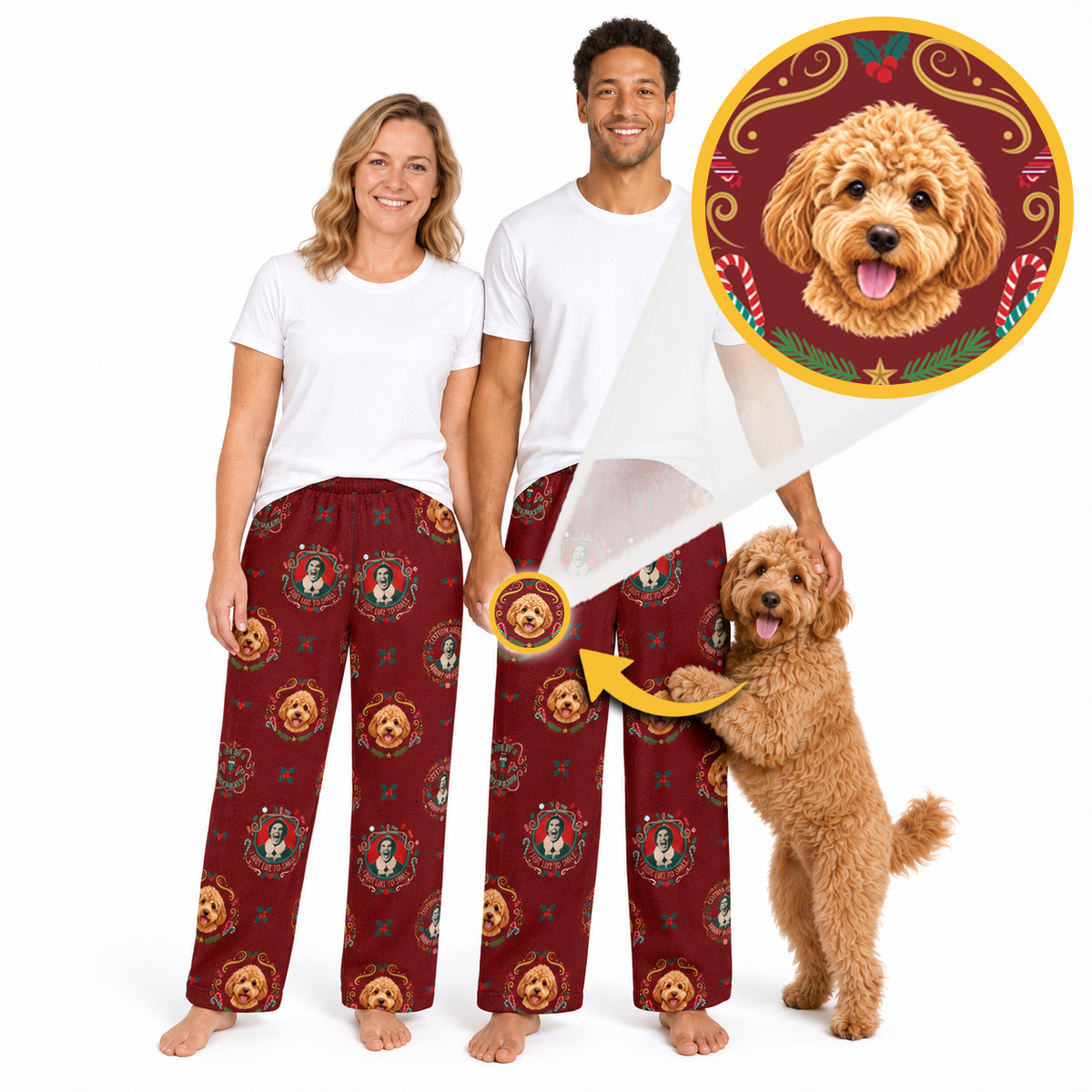 A man and a woman wearing matching burgundy pajama pants with a gold and brown dog medallion print, standing barefoot against a white background. A golden doodle dog is standing next to them, and a circular inset shows the printed design detail.