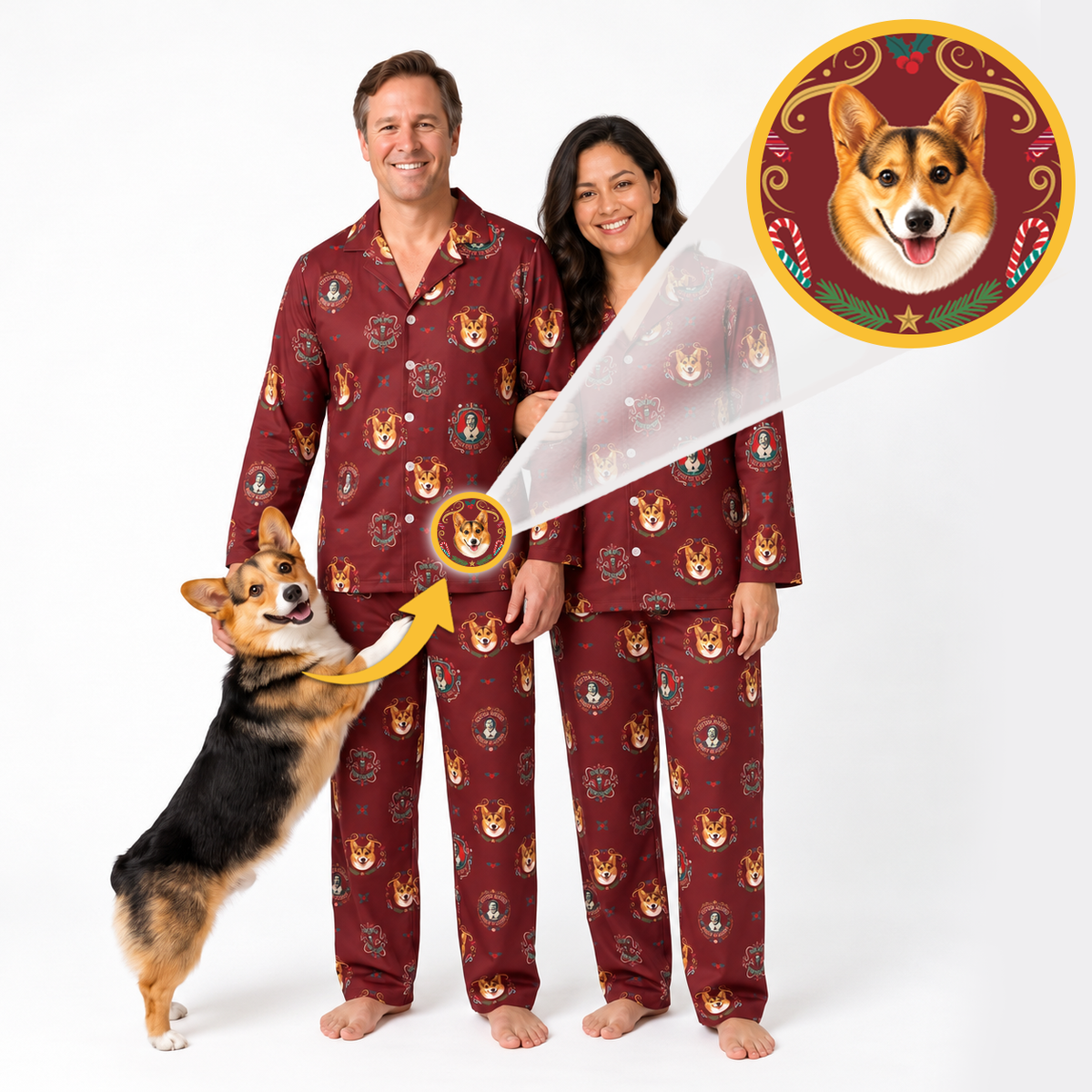 A man and a woman wearing matching burgundy pajamas with a corgi face print, standing barefoot on a white studio background. A corgi dog is jumping up on the left, and a circular inset at the top right shows a close-up of the corgi face design on the pajama.