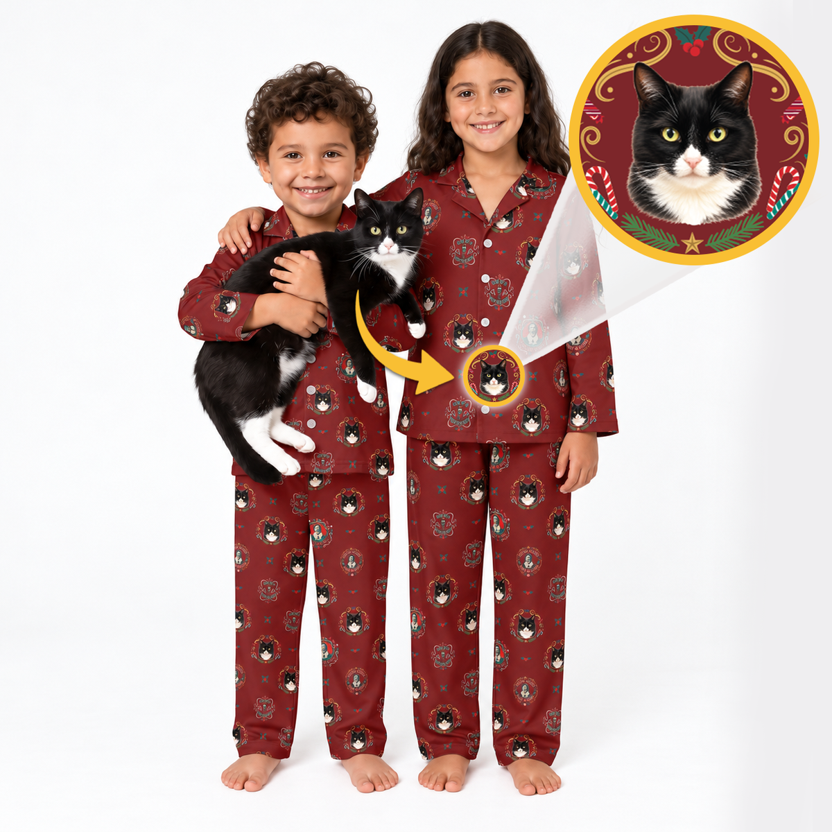 Two children wearing matching burgundy pajamas with a black-and-white cat print, standing barefoot on a white studio background. One child holds a black-and-white cat, and a circular inset shows a custom cat portrait design that appears on the pajama chest.
