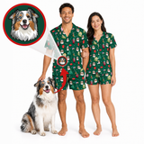 A man and a woman modeling matching green Christmas-themed pajamas with a dog sitting beside them, plus a circular inset showing a dog portrait and an arrow pointing to the printed dog motif on the pajamas. The background is a clean white studio backdrop.