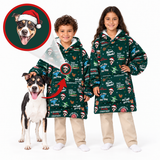 Two children and a dog wearing matching dark green Christmas-themed hooded blankets with a festive print, shown on a white background with a circular inset of a dog portrait wearing a Santa hat.