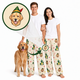 A man and a woman wearing matching Christmas-themed pajamas with a golden retriever dog, plus a circular inset showing a golden retriever wearing an elf hat. The pajamas are cream with green, red, and yellow holiday prints.