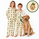 Two children wearing matching Christmas-themed pajamas stand next to a Golden Retriever dog on a white background. An inset circle shows a printed design of a Golden Retriever wearing a green elf hat, with arrows pointing to the child's pajama chest area.