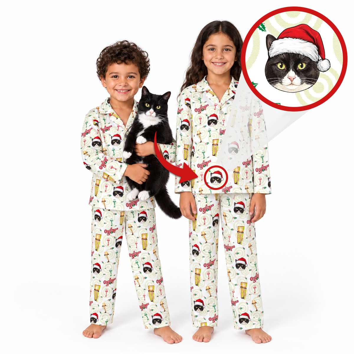 Two children wearing matching Christmas-themed pajamas with a black-and-white cat printed all over, standing on a white background. One child holds a real black-and-white cat, and a circular inset shows a cat wearing a Santa hat.