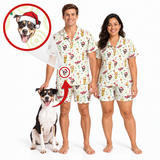 A man and a woman wearing matching holiday-themed short-sleeve pajamas with a dog print, standing next to a dog on a white background. An inset circle at the top left shows a dog wearing a Santa hat, with red arrows pointing to the printed dog motif on the pajamas.