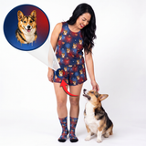 A woman modeling a matching navy blue pajama set with a corgi print, standing next to a corgi dog on a white studio background. A circular inset at the top left shows the custom corgi portrait design that inspired the print, with a red arrow pointing to the matching socks and shorts.