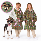 Two children wearing matching green plaid hooded jackets with a dog print pattern, standing next to a black and white dog on a white studio background. A circular inset at the top left shows a close-up of the dog print design.