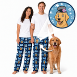 A man and a woman wearing matching blue patterned pajama pants and white t-shirts stand barefoot on a white background next to a golden retriever. A circular inset shows a cartoon dog wearing a hat, with an arrow pointing to the printed design on the pants.