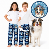 Two children and a dog modeling matching navy blue pajama pants with a repeating circular dog-face print and white T-shirts, on a white background. A circular inset shows a cartoon dog illustration with snowflakes, and arrows indicate the print is scalable.