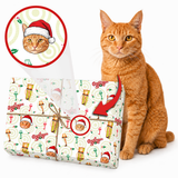 An orange cat sits beside a wrapped gift box on a white background. The gift is wrapped in a festive cream paper pattern featuring Christmas illustrations and a cat portrait, with a red arrow pointing to a matching circular close-up of the cat design.