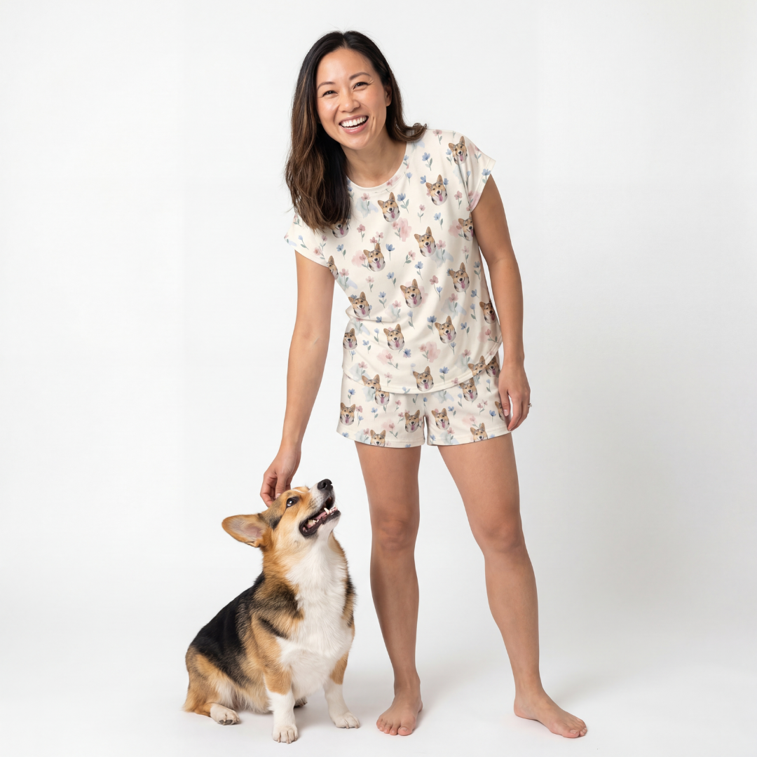 Woman wearing a fitted pajama set with a dog on a white background