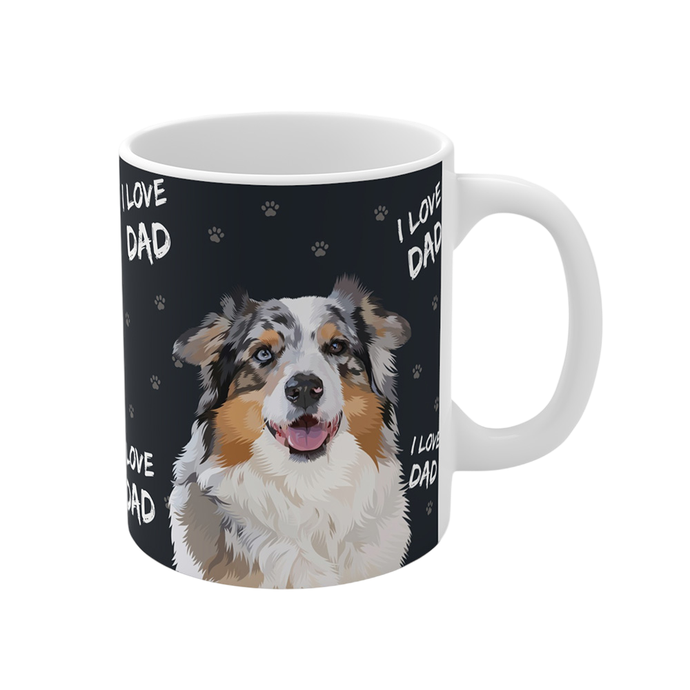 Close up of a black ceramic mug with paws and the phrase "I Love Dad", featuring a smiling, multicolored Australian Shepherd
