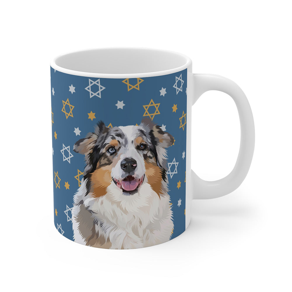 White ceramic mug featuring an illustrated portrait of an Australian Shepherd on a blue background decorated with white and gold Stars of David.