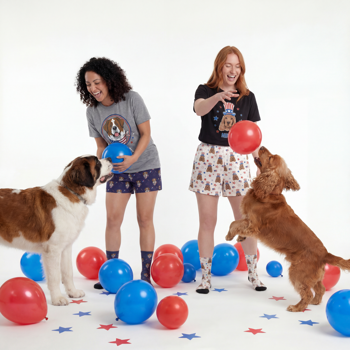Two women playing with dogs and balloons on a white background