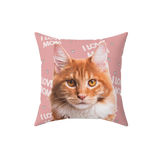 Pink pillow with hearts and the phrase "I love mom", it features a portrait of a cat. 