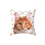 White pillow with paws and bones, it features an illustration of a cat.