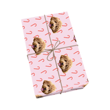Pink dog portrait wrapping paper with candy canes and golden ribbon