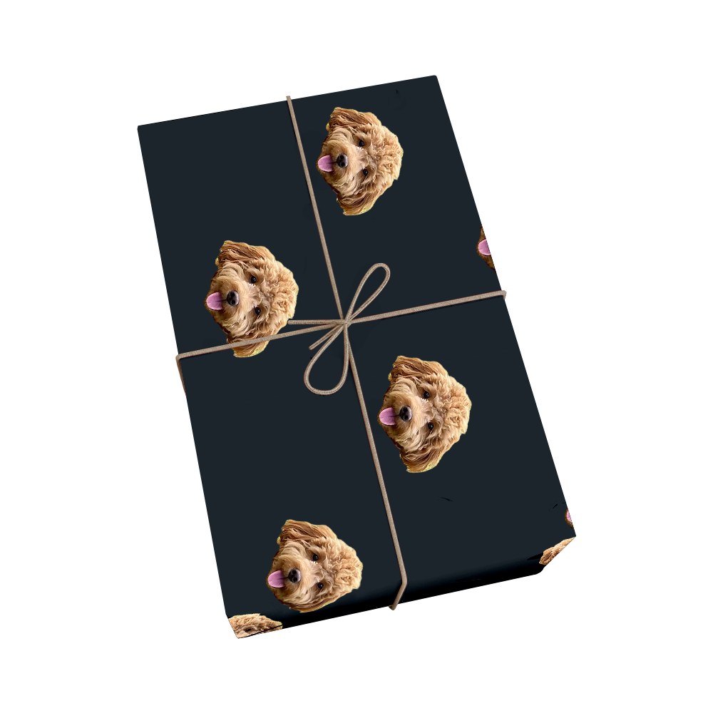 Custom pet wrapping paper in black color featuring repeating pattern of dog portraits with golden ribbon design