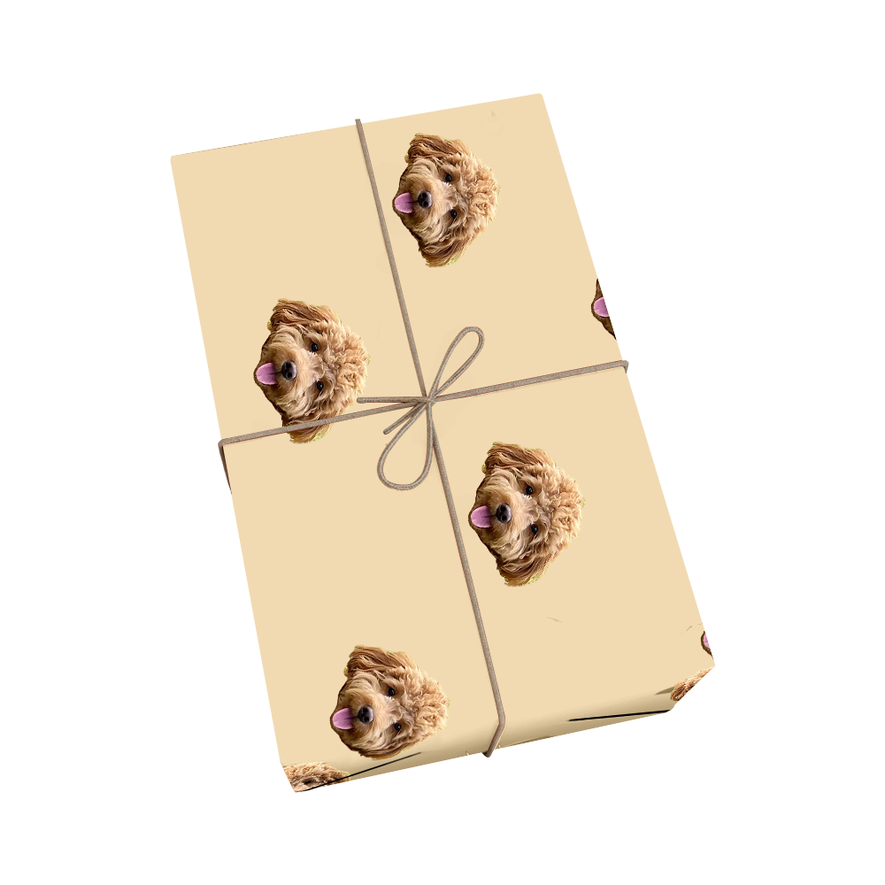 Butter yellow pet wrapping paper with dog portraits and a golden ribbon design.