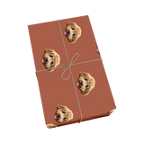 Cocoa brown pet wrapping paper with dog portraits and a golden ribbon design.