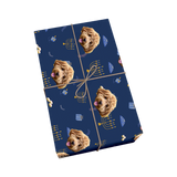Dark blue Hanukkah pet wrapping paper with dog portraits, menorahs, and gold ribbon.