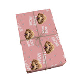 Pink wrapping paper with hearts, "I love mom" phrases and dogs