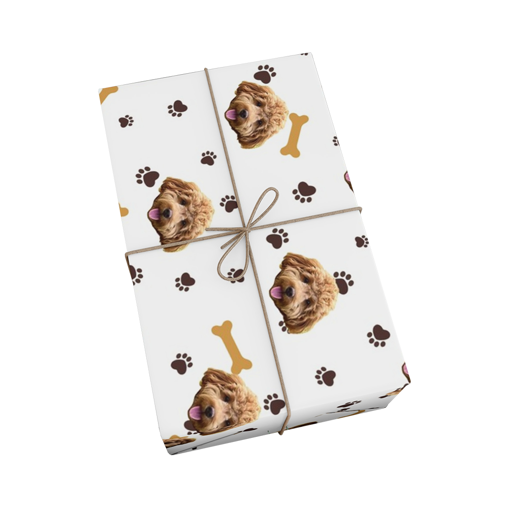 White wrapping paper with paws, bones and dog faces