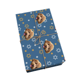 Gift wrap with dog pattern and star designs on a blue background